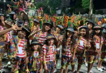 Ala “A Voz do Morro é de Criança”, da Unidos de Bangu, ecoa um grito de resistência e fé nas novas gerações pela Sapucaí